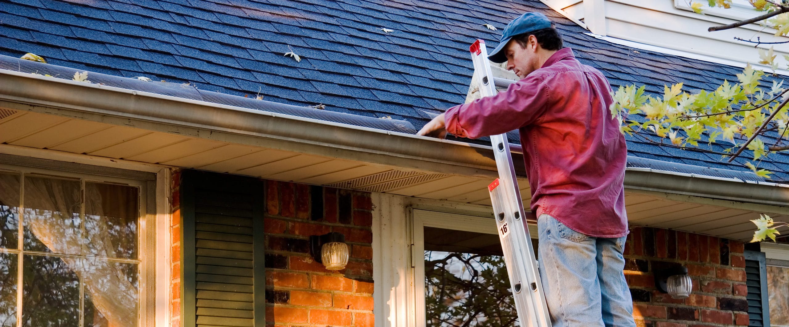 https://handymanconnection.com/wp-content/uploads/2017/10/bigstock-Man-Cleaning-Gutters-9331940-e1566484011680.jpg